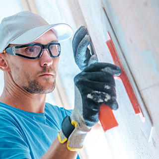 Réparer un mur abimé avec la toile de verre !